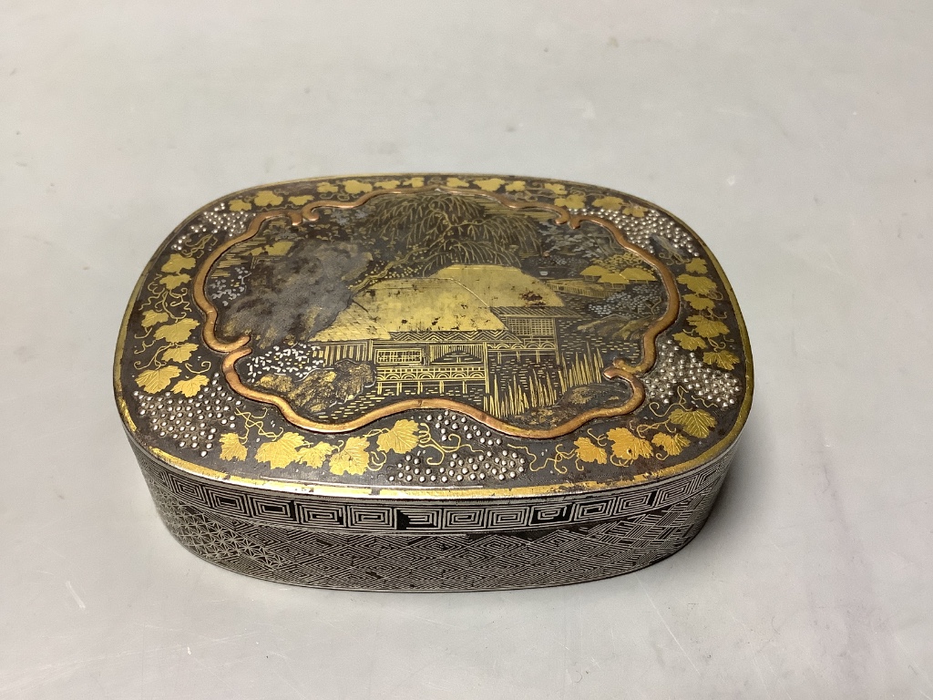 A 19th-century Japanese gold and silver damascened iron incense box and cover, 9.5cm